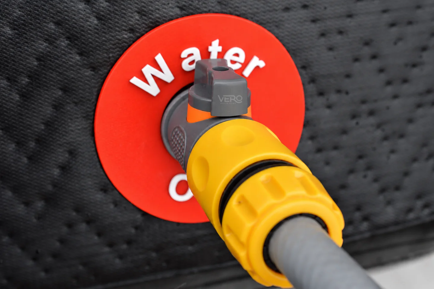 Vero Recovery Ice Bath Hose Pipe Drain Valve connected to the water outlet with a hose attached, draining the ice bath