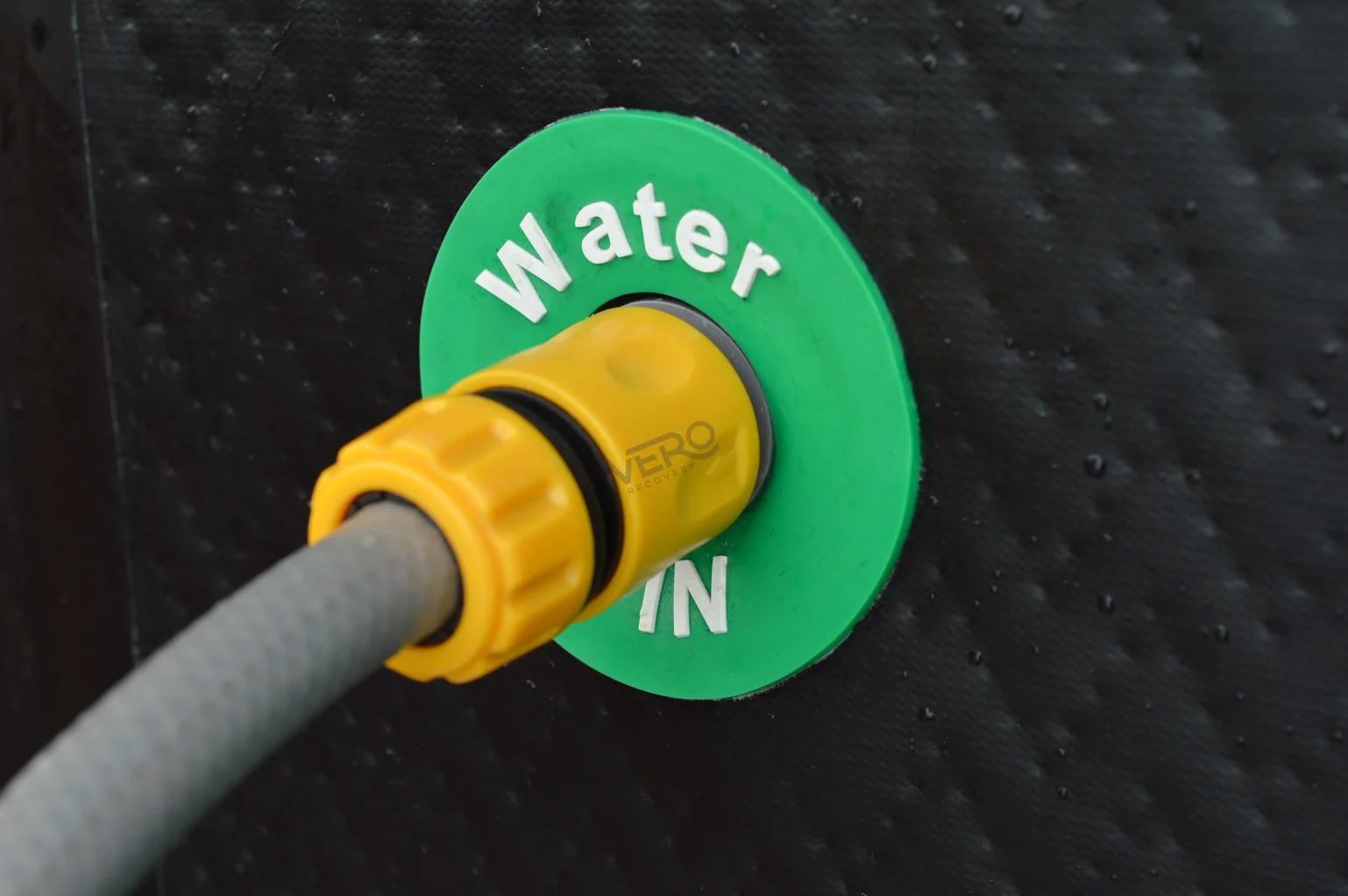 Vero Recovery Ice Bath Hose Connector fitted to the water inlet with a hose attached