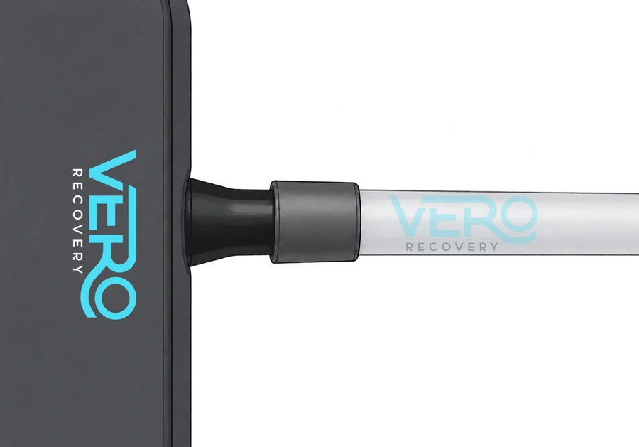 Connecting the hose to the black connector on the Vero Recovery Ozone Generator